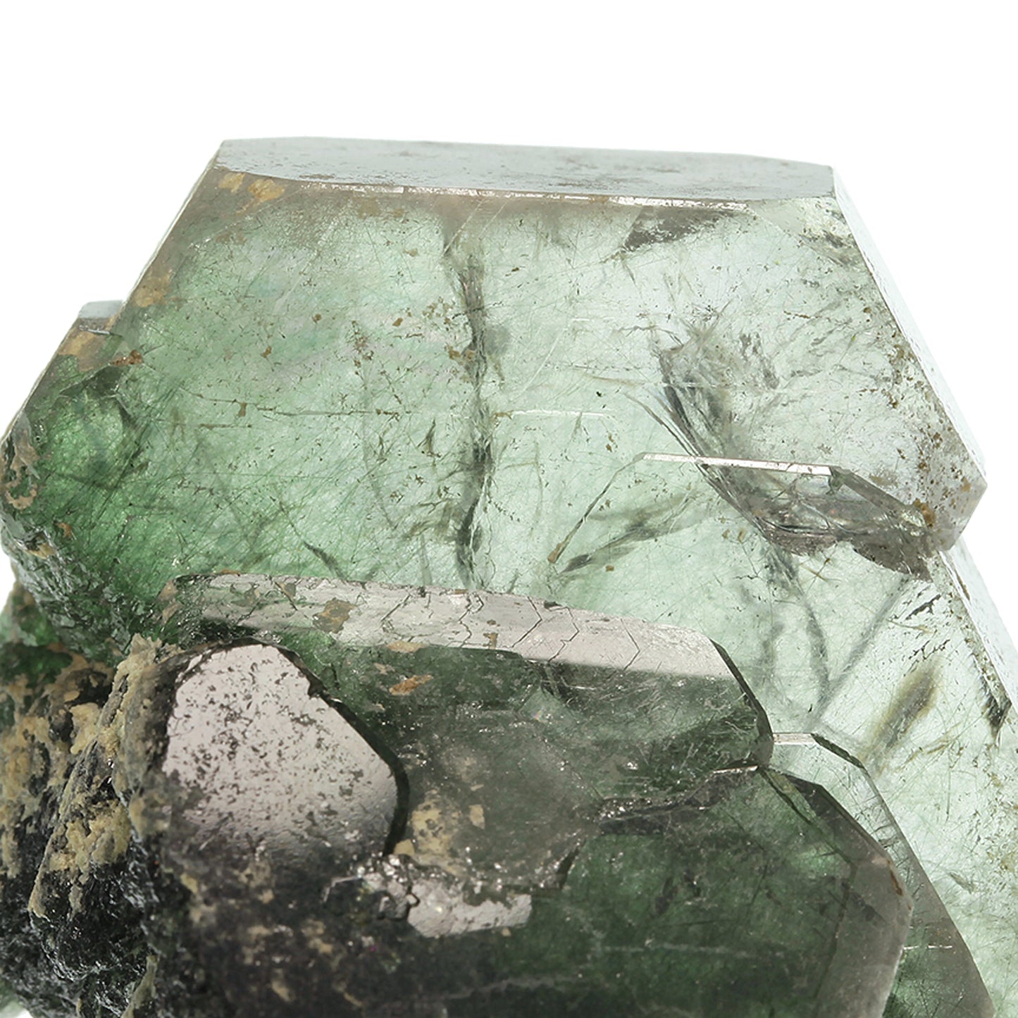 Fluorapatite with Actinolite (var: Byssolite) inclusions