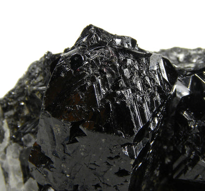 Cassiterite 
(“drill bit” twins)