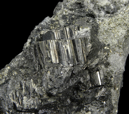 Bournonite 
(“cogwheel”) on matrix